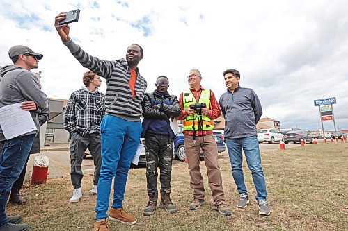 27042023
Second year Civil Technology program students from Assiniboine Community College take a selfie with Mario Machado (R), a surveyor with Dillon Consulting during a field trip by the class to study the Daly Overpass replacement project on Thursday.  (Tim Smith/The Brandon Sun)