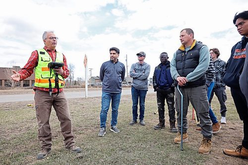 27042023
Mario Machado, a surveyor with Dillon Consulting, talks to second year Civil Technology program students from Assiniboine Community College about new surveying technology including the use of drones during a field trip by the class to the Daly Overpass replacement project on Thursday.  (Tim Smith/The Brandon Sun)