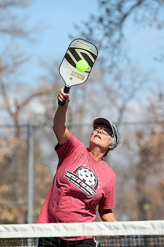 Marilyn Woods with the Brandon Pickleball Club returns the ball during a match with friends at the Stanley Park courts Friday morning. (Tim Smith/The Brandon Sun)