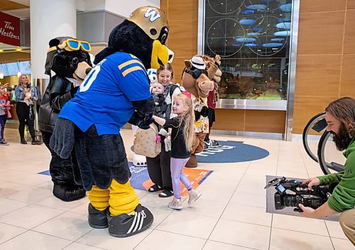 JESSICA LEE / WINNIPEG FREE PRESS

Ellie Stebner, 4, Morgan Stebner and Kash, 4 months, meet Manitoba&#x2019;s tourism and recreation mascots after stepping off their flight at Winnipeg&#x2019;s Richardson Airport April 28, 2023. The mascots were there to celebrate tourism week in Canada.

Stand up