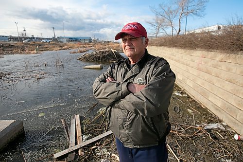 BROOK JONES / WINNIPEG FREE PRESS
West End resident Ken Yendrys, 78, looks at the poor condition of Omand's Creek because of the excees amounts of garbage along the banks of the creek that runs along Empress Street in Winnipeg, Man. Yendrys, who was pictured Saturday, April 29, 2023, says the creeks is also being damaged because of beaver dams.  