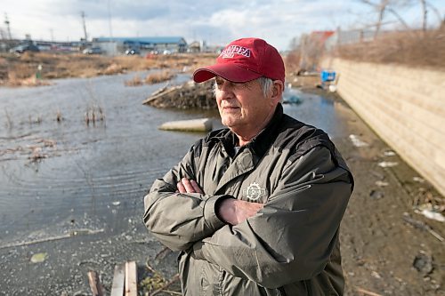 BROOK JONES / WINNIPEG FREE PRESS
West End resident Ken Yendrys, 78, looks at the poor condition of Omand's Creek because of the excees amounts of garbage along the banks of the creek that runs along Empress Street in Winnipeg, Man. Yendrys, who was pictured Saturday, April 29, 2023, says the creeks is also being damaged because of beaver dams.  