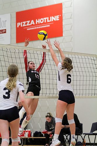 Westman Volleyball Club's Mackenzie Lyburn (12) jumps for a joust against Cats Volleyball Club during the quarterfinals. (Thomas Friesen/The Brandon Sun)