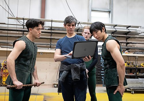 JESSICA LEE / WINNIPEG FREE PRESS

From left to right: Royal Winnipeg Ballet dancers Liam Saito, Parker Long, and Yue Shi, who all play Peter Pan in RWB&#x2019;s upcoming production of Peter Pan, look at choreography on the laptop of Jaime Vargas (second from left) during a session where they practice flying April 29, 2023 in a warehouse in the Exchange District in preparation for their roles.

Reporter: Jen Zoratti