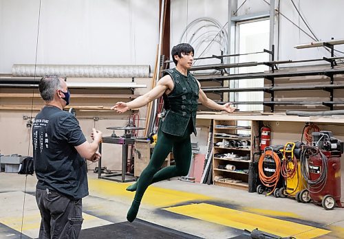 JESSICA LEE / WINNIPEG FREE PRESS

Royal Winnipeg Ballet dancer Yue Shi, who plays Peter Pan in RWB&#x2019;s upcoming production of Peter Pan, practices flying April 29, 2023 in a warehouse in the Exchange District in preparation for his role. Harold Christensen (left) the flying expert, coaches Shi.

Reporter: Jen Zoratti