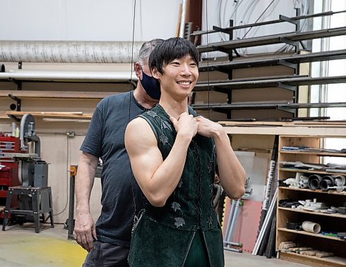 JESSICA LEE / WINNIPEG FREE PRESS

Royal Winnipeg Ballet dancer Yue Shi, who plays Peter Pan in RWB&#x2019;s upcoming production of Peter Pan, practices flying April 29, 2023 in a warehouse in the Exchange District in preparation for his role. Harold Christensen (left) the flying expert, preps Shi&#x2019;s harness.

Reporter: Jen Zoratti