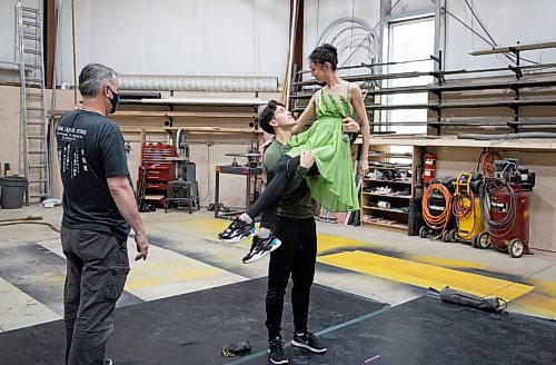 JESSICA LEE / WINNIPEG FREE PRESS

Royal Winnipeg Ballet dancers Liam Saito, who plays Peter Pan, and Chenxin Liu, who plays Tinkerbell in RWB&#x2019;s upcoming production of Peter Pan, practice a scene where Peter catches Tinkerbell April 29, 2023 in a warehouse in the Exchange District in preparation for their roles. Harold Christensen (left), the flying expert, helps them.

Reporter: Jen Zoratti