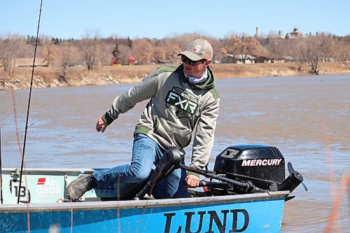 Matt Lintott takes his fishing boat out on the Assiniboine River during a windy Monday afternoon in Brandon. While not ideal conditions for fishing, Lintott told the Sun he likes to get a head start on the summer fishing season by running his boat in the spring to troubleshoot any mechanical issues. (Kyle Darbyson/The Brandon Sun)