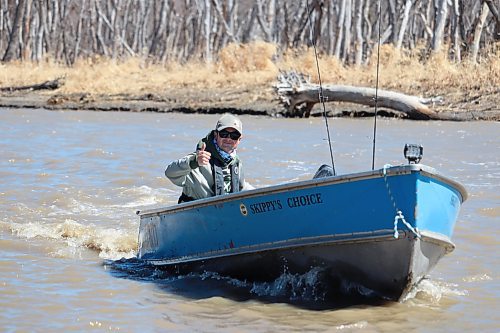 Matt Lintott takes his fishing boat out on the Assiniboine River during a windy Monday afternoon in Brandon. While not ideal conditions for fishing, Lintott told the Sun he likes to get a head start on the summer fishing season by running his boat in the spring to troubleshoot any mechanical issues. (Kyle Darbyson/The Brandon Sun)