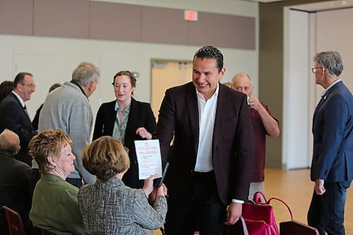 Manitoba's leader of the NDP, Wab Kinew shakes hands with a Virden resident while announcing his healthcare platform at the Tundra Oil and Gas Place on Monday. (Michele McDougall/The Brandon Sun)