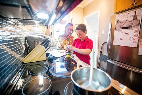 MIKAELA MACKENZIE / WINNIPEG FREE PRESS
 
Jack Taylor, 10, makes lemon curd for mini cheesecakes with his mom, Meghan, in Winnipeg on Monday, May 1, 2023. For Eva story.

Winnipeg Free Press 2023.