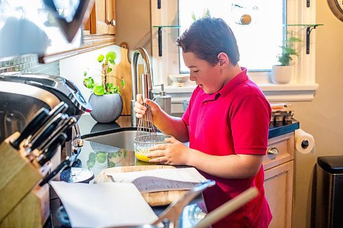 MIKAELA MACKENZIE / WINNIPEG FREE PRESS
 
Jack Taylor, 10, whisks eggs and sugar while making lemon curd for mini cheesecakes that he&#x573; planning on making for his mom this mother&#x573; day in Winnipeg on Monday, May 1, 2023. For Eva story.

Winnipeg Free Press 2023.