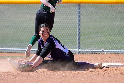 Massey's Billie Baranyk does the splits to stretch for an out at first base. (Thomas Friesen/The Brandon Sun)