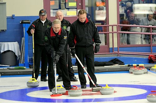 Doug Armour, left, and Kelly Robertson talk over their shot options during the 2010 provincial senior men's playdowns at the Brandon Curling club. (Brandon Sun files)