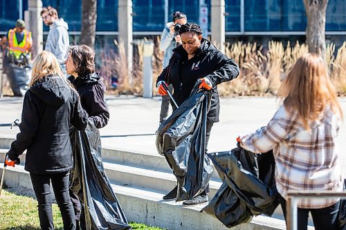 MIKAELA MACKENZIE / WINNIPEG FREE PRESS
 
Doris Ozigbo picks up garbage at the Downtown Winnipeg BIZ annual community cleanup in Winnipeg on Tuesday, May 2, 2023. Standup.

Winnipeg Free Press 2023.