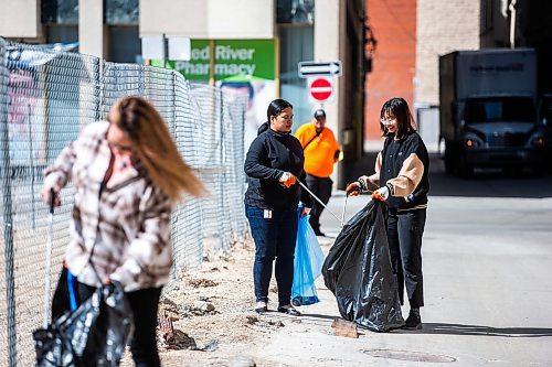 MIKAELA MACKENZIE / WINNIPEG FREE PRESS
 
Jaclyn Wall (left) and Julie Pham pick up garbage at the Downtown Winnipeg BIZ annual community cleanup in Winnipeg on Tuesday, May 2, 2023. Standup.

Winnipeg Free Press 2023.