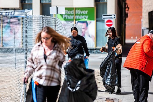 MIKAELA MACKENZIE / WINNIPEG FREE PRESS
 
Jaclyn Wall (left) and Julie Pham pick up garbage at the Downtown Winnipeg BIZ annual community cleanup in Winnipeg on Tuesday, May 2, 2023. Standup.

Winnipeg Free Press 2023.