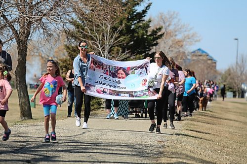 Co-organizers Adrienne McNish and Amy Rabe lead more than 150 participants in Flora's Walk to raise money and awareness for postpartum depression in Brandon on Wednesday. (Michele McDougall/The Brandon Sun)