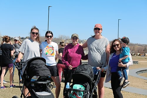 Expectant mother, Loren White (fourth from left), with her friends at the start of Flora's Walk at the Riverbank Discovery Centre on Wednesday. (Michele McDougall/The Brandon Sun)