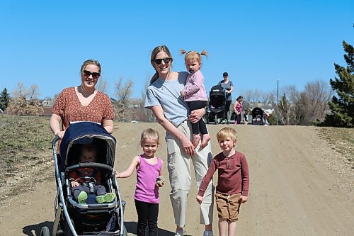 Brandon mother Steph Johnston with Kohen in stroller and daughter Sadie, with Mom Alex Wells holding her daughter Reese, while her son Wyatt holds on during the second annual Flora's Walk on Wednesday. (Michele McDougall/The Brandon Sun)