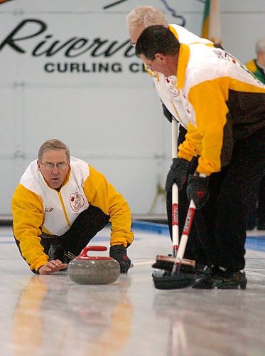 Doug Armour of Souris delivers a shot in the seventh end of the 2005 Canadian masters men's curling championship at the Riverview Curling Club. (Brandon Sun files)