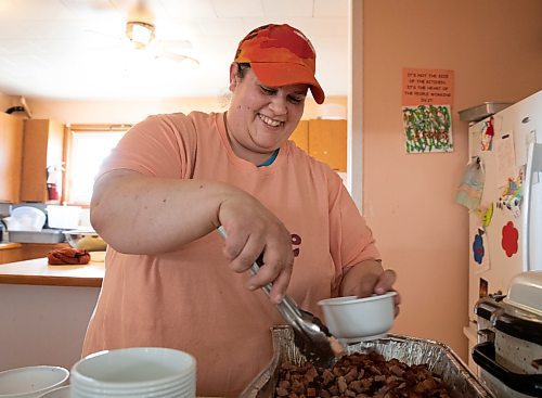 JESSICA LEE / WINNIPEG FREE PRESS

Meredith Robinson puts ham into soup bowls May 3, 2023 at the kreative Kitchen at St. Thomas Anglican in Weston, where food insecure community members gather to pick up hot meals and a hamper on Wednesday nights.

Reporter: John Longhurst