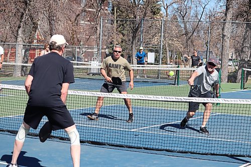 Members of the Brandon Pickleball Club take advantage of the city's recent warm weather by organizing a couple games at Stanley Park on Thursday morning. (Kyle Darbyson/The Brandon Sun)