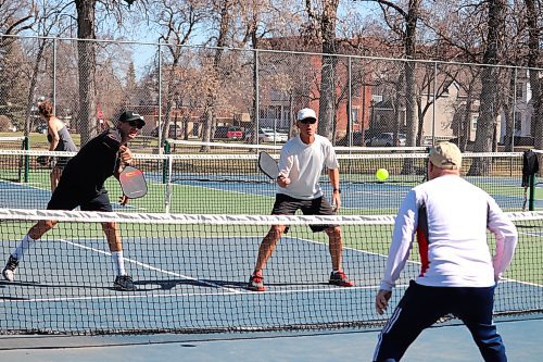 Members of the Brandon Pickleball Club take advantage of the city's recent warm weather by organizing a couple games at Stanley Park on Thursday morning. (Kyle Darbyson/The Brandon Sun)