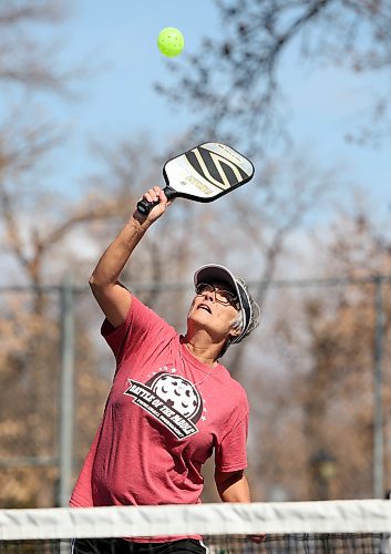 Marilyn Woods with the Brandon Pickleball Club returns the ball during a match with friends at the Stanley Park courts. (Tim Smith/The Brandon Sun)