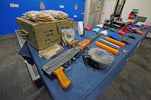 A Type-81 rifle, ammunition and 3D-printed ammunition magazines seized by Winnipeg police in March. ERIK PINDERA/WINNIPEG FREE PRESS