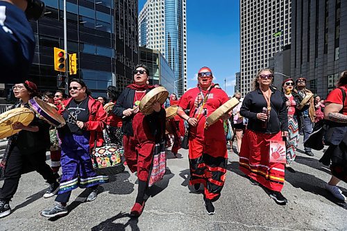 RUTH BONNEVILLE / WINNIPEG FREE PRESS 

LOCAL - MMIWG 

Organizers planned a round dance at Portage and Main at noon to honour the National Day of Awareness of Missing and Murdered Indigenous Women and Girls and Two-Spirited Peoples (MMIWG2S+).  The gathering moved into a march to the Forks after drumming event. 
 
May 5th,, 2023