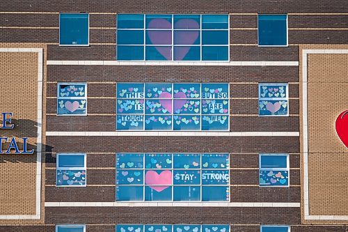 Daniel Crump / Winnipeg Free Press. Hearts and signs with messages of encouragement can be seen adorning the south side of the Grace Hospital, from Portage Avenue. April 10, 2020.