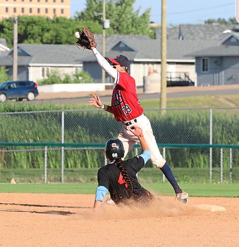 Sioux Valley Dakotas base runner Sage Hall-Vermette slides safely into the bag as Murray Chevrolet Cubs second baseman Derek Sobkow catches the throw from the plate during the Andrew Agencies Senior AA Baseball League&#x2019;s play-in game at Andrews Field last August. Sioux Valley lost the game but will return for their second season this summer. (Perry Bergson/The Brandon Sun)