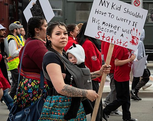 JESSICA LEE / WINNIPEG FREE PRESS

A community member walks with a sign. Hundreds gathered at The Forks May 5, 2023 to march to the Legislative Building for National Day of Awareness of Missing and Murdered Indigenous Women and Girls and Two-Spirited Peoples.

Reporter: Gabby Piche