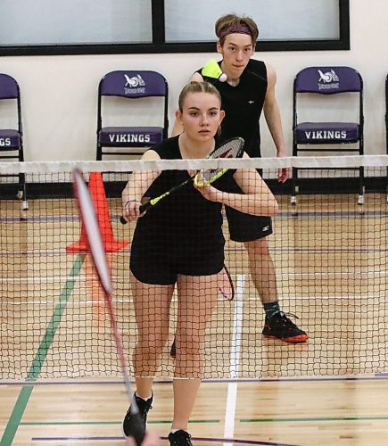 Amari Stocks serves under the watchful eye of partner Quintus McDaniel as the Neelin duo play in the mixed doubles event of the Vincent Massey badminton tournament on Saturday. The duo fell in the final to Massey’s Jia Yuan Li and Marie Bartolome. (Perry Bergson/The Brandon Sun)