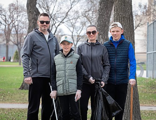JESSICA LEE / WINNIPEG FREE PRESS

From left to right: Ukrainians Andrii, Marko Tanya, and Arsen clean up St. John&#x2019;s Park May 6, 2023 as part of a community clean-up to give back to Manitobans who&#x2019;ve welcomed refugees fleeing from the war.

Stand up