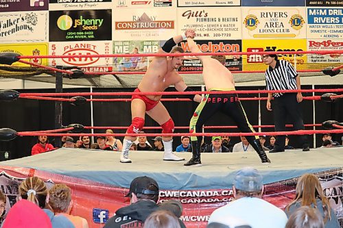 Shaun Martens ties up opponent Sammy Peppers during a Canadian Wrestling's Elite show at the Riverdale Community Centre on Saturday evening. (Kyle Darbyson/The Brandon Sun)