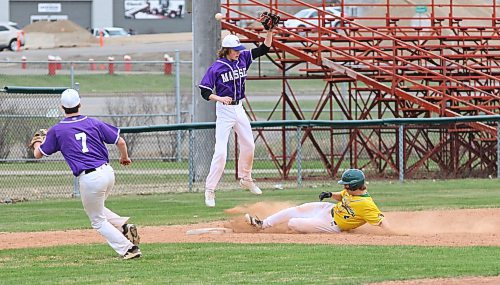 Boissevain base runner Brett Laing (4) slides in safely as Vincent Massey third baseman KC Couckuyt (5) jumps for a high throw as Carter Dittmer (7) covers the play on Sunday afternoon at Andrews Field in Prairie West High School Baseball League. (Photos by Perry Bergson/The Brandon Sun)