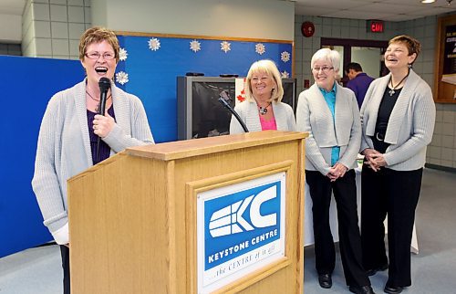 Joyce McDougall laughs along with teammates Linda Van Daele, Cheryl Orr and Karen Dunbar during a reception to honour the Provincial Masters Women's Curling Champions at the Brandon Curling Club in February 2012. McDougall had a cast on her right wrist after breaking it in a fall on the ice during the senior women's provincials that month. (Tim Smith/Brandon Sun)