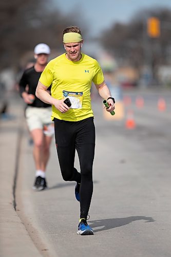 BROOK JONES / WINNIPEG FREE PRESS
K&amp;B Combo relay team member Karl Sproll Jr., who is a former member of the University of Manitoba Bisons cross country and track &amp; field teams, is seen on Portage Avenue with one kilometre until the finish line in the Winnipeg Police Service Half Marathon Relay in Winnipeg, Man., Sunday, May 7, 2023. 