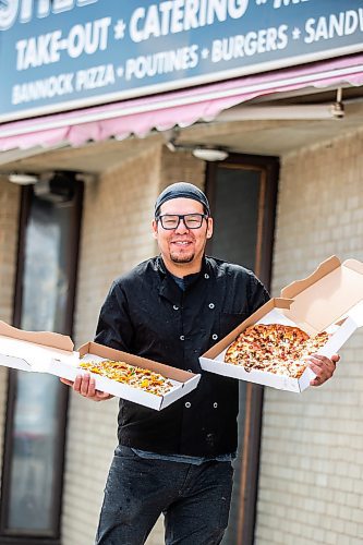 MIKAELA MACKENZIE / WINNIPEG FREE PRESS
 
Owner Vince Bignell holds taco (left) and North Ender pizzas outside of Shelly's Indigenous Diner in Winnipeg on Friday, May 5, 2023. For Dave story.

Winnipeg Free Press 2023.