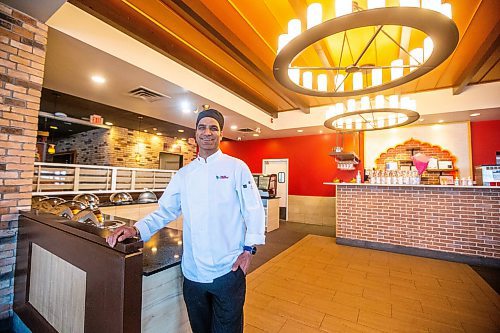 MIKAELA MACKENZIE / WINNIPEG FREE PRESS

Laxman Negi, chef and co-owner of Chilli Chutney, poses for a photo in the new location on Kenaston in Winnipeg on Wednesday, April 26, 2023. For Gabby story.

Winnipeg Free Press 2023.