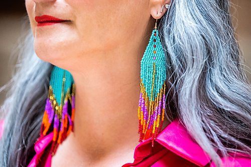 MIKAELA MACKENZIE / WINNIPEG FREE PRESS
 
NDP MLA Nahanni Fontaine poses for a photo wearing Women Helping Women Beadwork earrings at the Manitoba Legislative Building in Winnipeg on Monday, May 8, 2023. For Kevin story.

Winnipeg Free Press 2023.