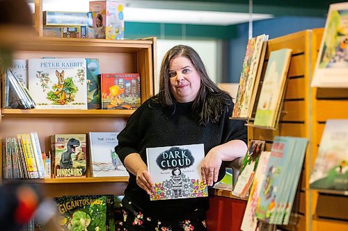 MIKAELA MACKENZIE / WINNIPEG FREE PRESS
 
Local children&#x2019;s author Anna Lazowski poses for a photo with her new book, Dark Cloud, at McNally Robinson in Winnipeg on Monday, May 8, 2023. For Jen story.

Winnipeg Free Press 2023.