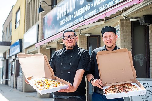 MIKAELA MACKENZIE / WINNIPEG FREE PRESS
 
Owner Vince Bignell (left) and his brother, Kevin Woods, hold taco and North Ender pizzas outside of Shelly's Indigenous Diner in Winnipeg on Friday, May 5, 2023. For Dave story.

Winnipeg Free Press 2023.