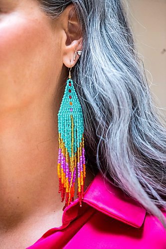 MIKAELA MACKENZIE / WINNIPEG FREE PRESS
 
NDP MLA Nahanni Fontaine poses for a photo wearing Women Helping Women Beadwork earrings at the Manitoba Legislative Building in Winnipeg on Monday, May 8, 2023. For Kevin story.

Winnipeg Free Press 2023.