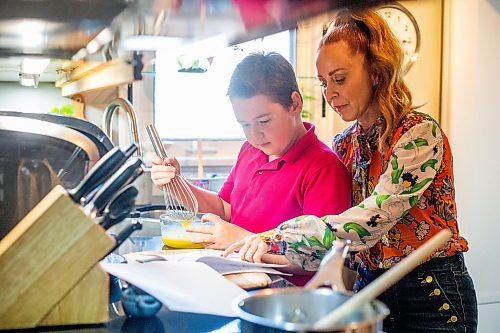 MIKAELA MACKENZIE / WINNIPEG FREE PRESS
 
Jack Taylor, 10, makes lemon curd for mini cheesecakes with his mom, Meghan, in Winnipeg on Monday, May 1, 2023. For Eva story.

Winnipeg Free Press 2023.