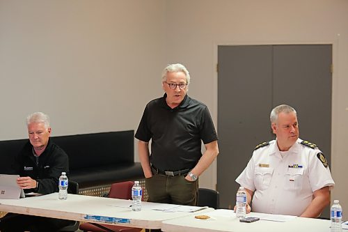 Coun. Glen Parker (Ward 9, centre) addresses residents at a ward meeting held at the East End Community Centre on Tuesday night as director of parks and recreation services Perry Roque (left) and Brandon Police Service Chief Wayne Balcaen (right) look on. (Colin Slark/The Brandon Sun)