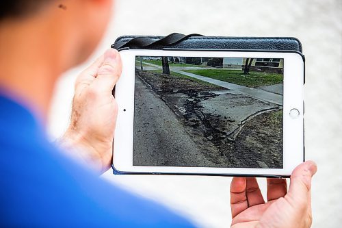 MIKAELA MACKENZIE / WINNIPEG FREE PRESS
 
Eugene Osudar&#x573; damaged driveway, which he says was broken by the city&#x573; street cleaning equipment, in Winnipeg on Tuesday, May 9, 2023. For &#x460;story.

Winnipeg Free Press 2023.