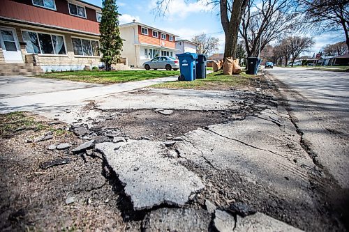 MIKAELA MACKENZIE / WINNIPEG FREE PRESS
 
Eugene Osudar&#x573; damaged driveway, which he says was broken by the city&#x573; street cleaning equipment, in Winnipeg on Tuesday, May 9, 2023. For &#x460;story.

Winnipeg Free Press 2023.